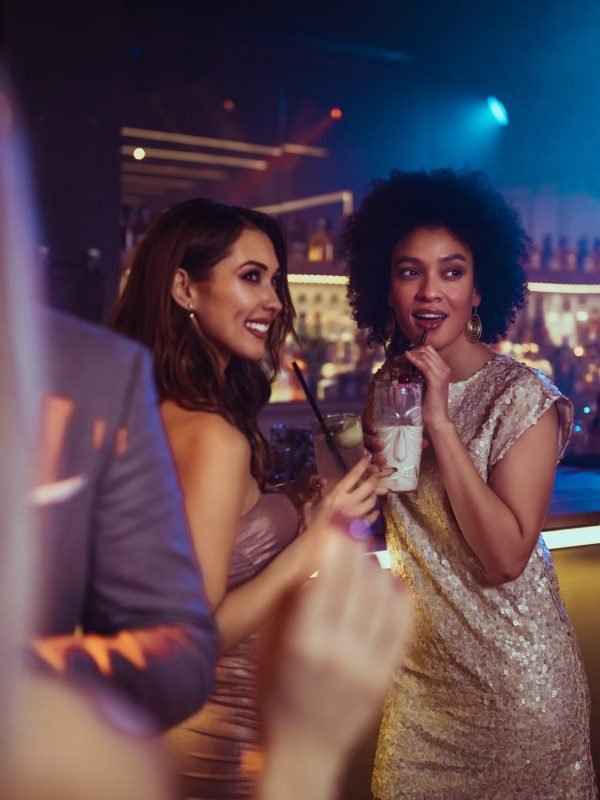 Young female friends enjoying at nightclub